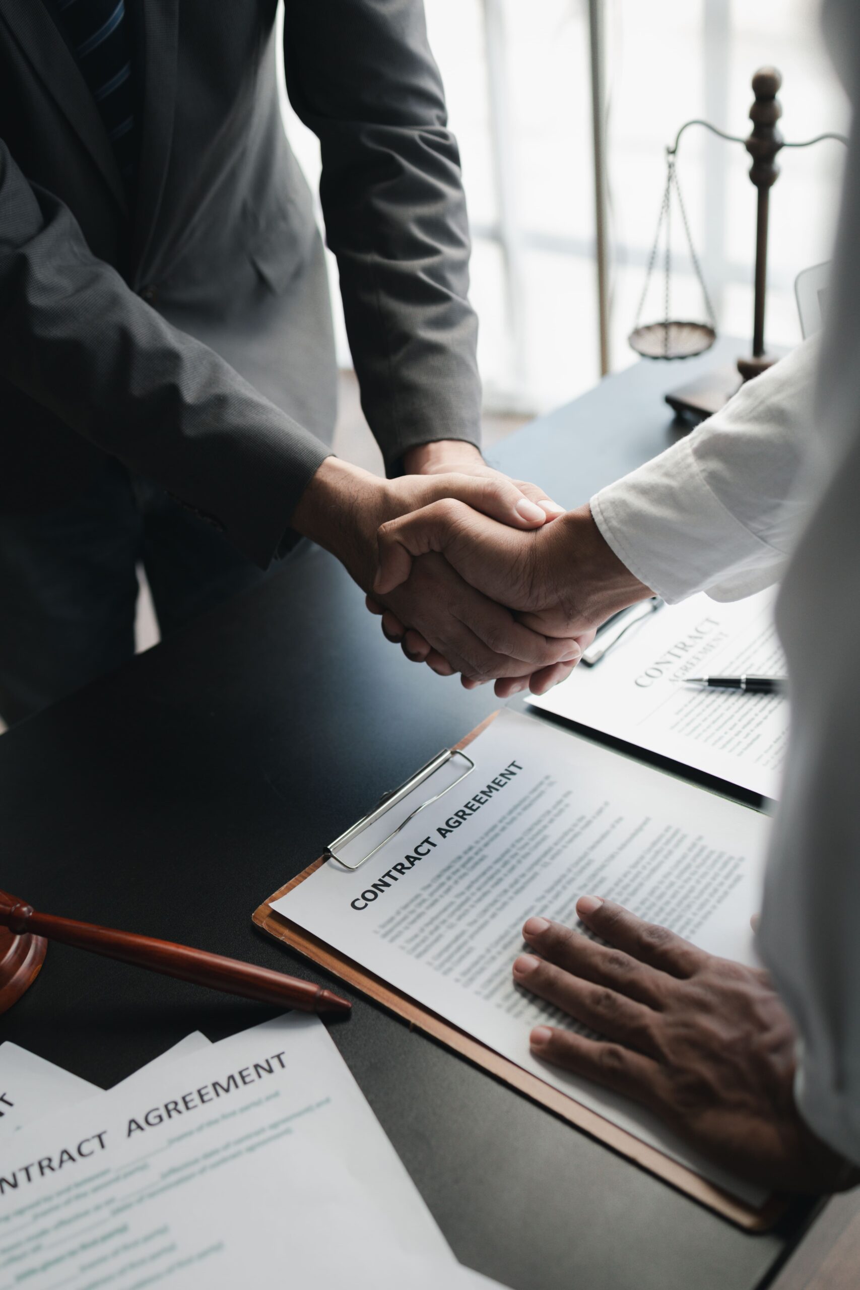 businessmen-shaking-hands-over-contract-agreement-2026-01-07-01-02-13-utc (1)